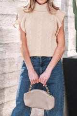 Front view of a beige cable knit turtleneck sweater with ruffled short sleeves