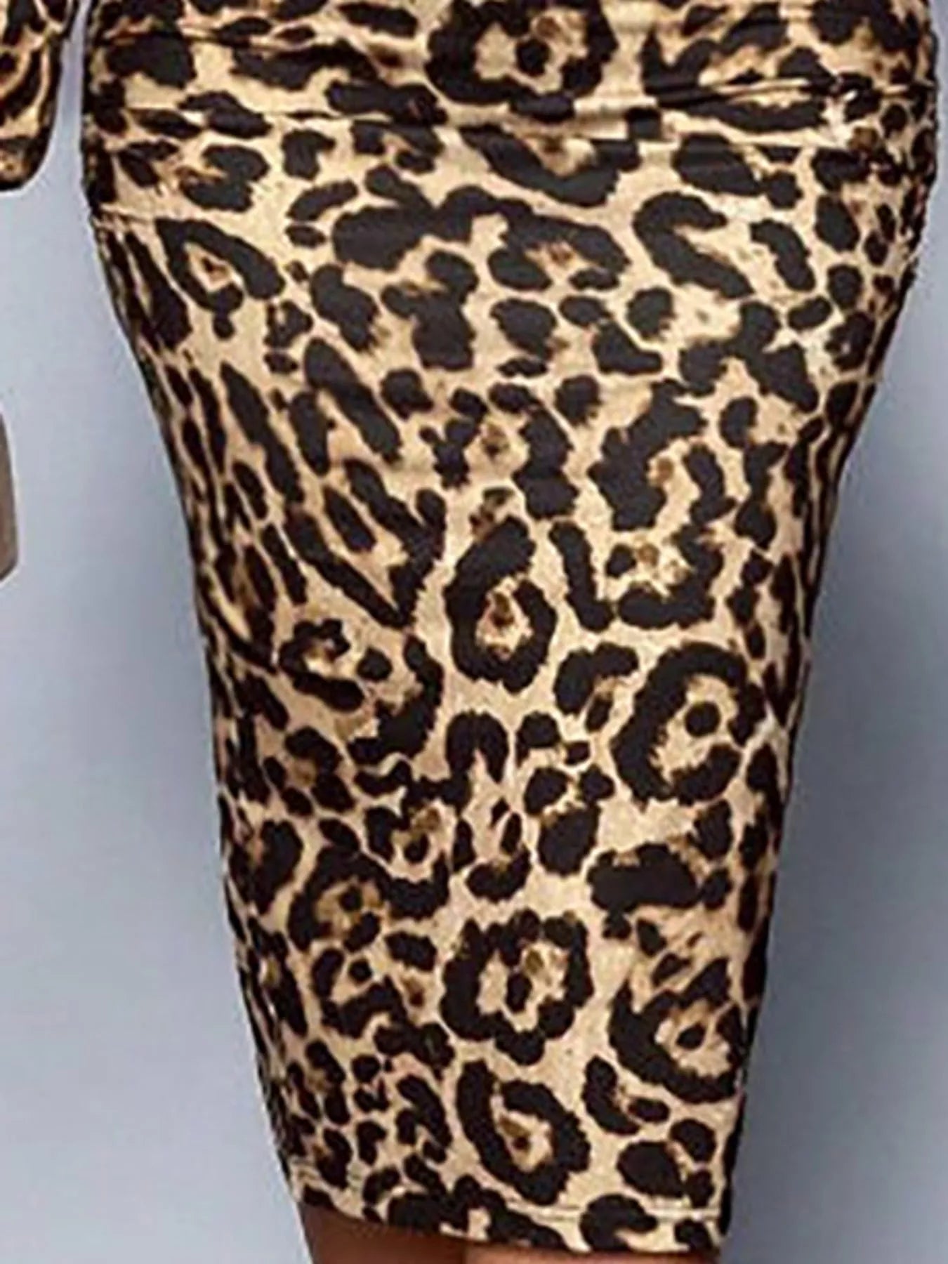 Close view of leopard print midi skirt showing the ruched fabric and pattern