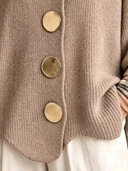 Close up of the khaki cardigan gold buttons and scalloped hem