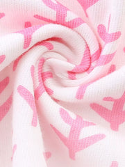 Close-up of the swirled blush pink patterned fabric of the children's seahorse tee