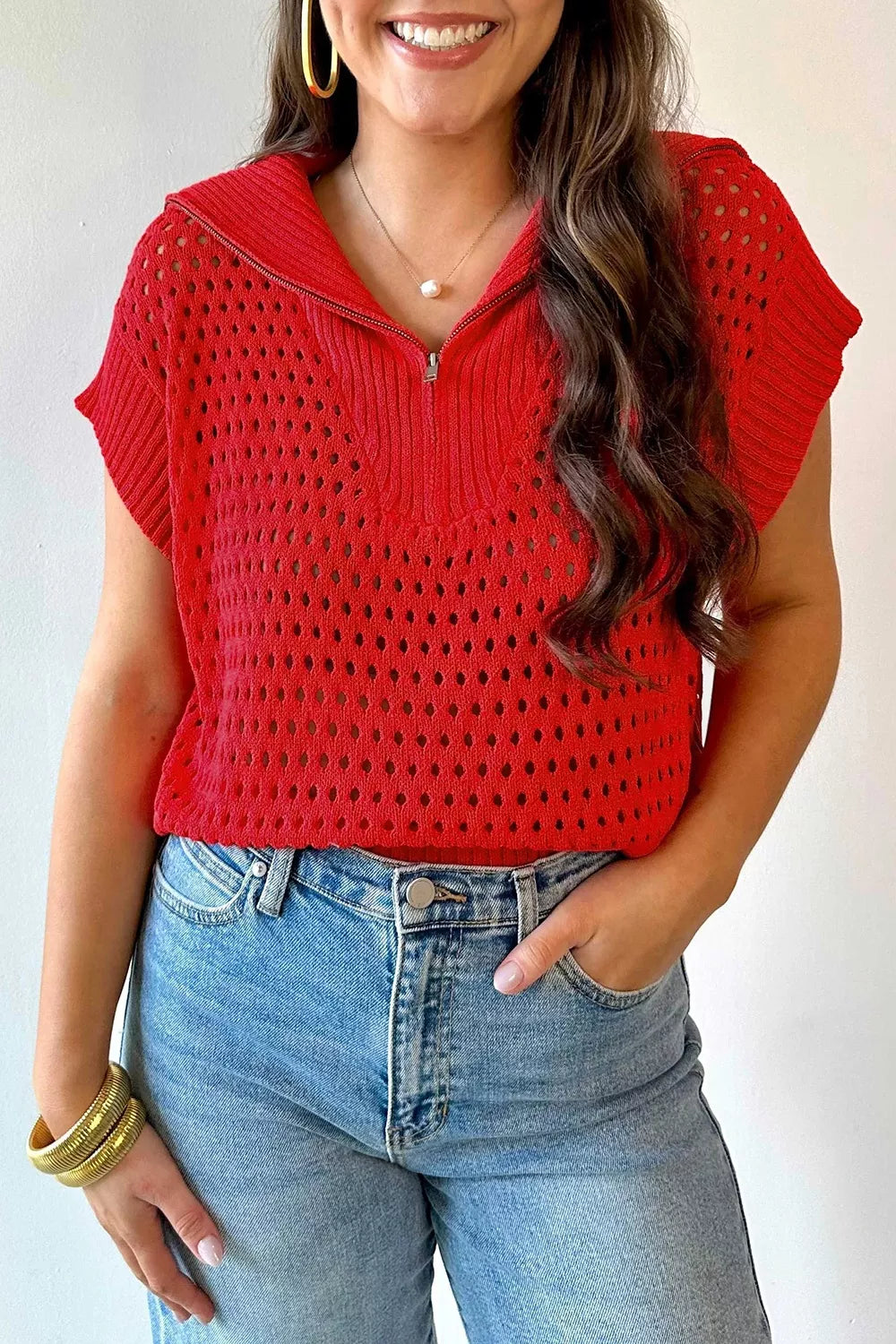 On-model front view of the red openwork quarter zip top with a ribbed collar