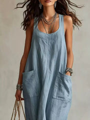 Cropped front view of light blue sleeveless scoop neck maxi dress, showing neckline and large pockets