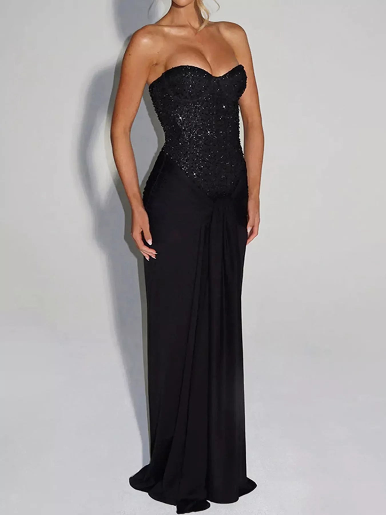 Black strapless sequin corset maxi dress on model, full length front view in studio