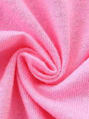 Close up of soft pink knitted fabric texture of children's short sleeve t-shirt