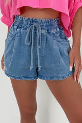 Women's high-waisted denim shorts with a drawstring waist and pockets.
