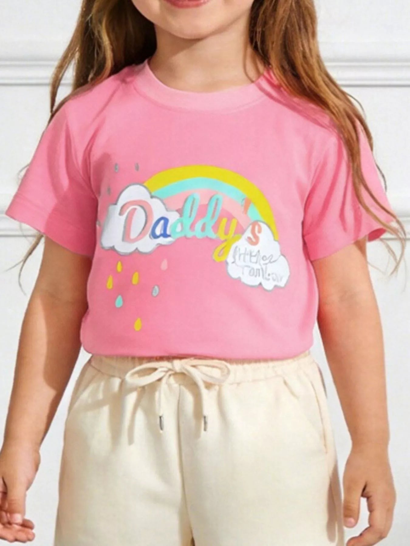Children's pink short-sleeve T-shirt featuring a rainbow graphic design.