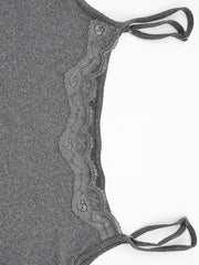Close view of grey lace panel and straps on the bodycon mini dress