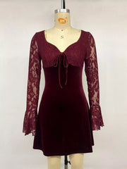 Burgundy lace mini dress with velvet skirt and front tie shown on mannequin front view