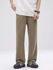 Men's taupe wide-leg casual pants with a drawstring waist.