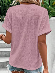 Back view of a mauve short-sleeve top featuring a subtle eyelet pattern and notched neckline.