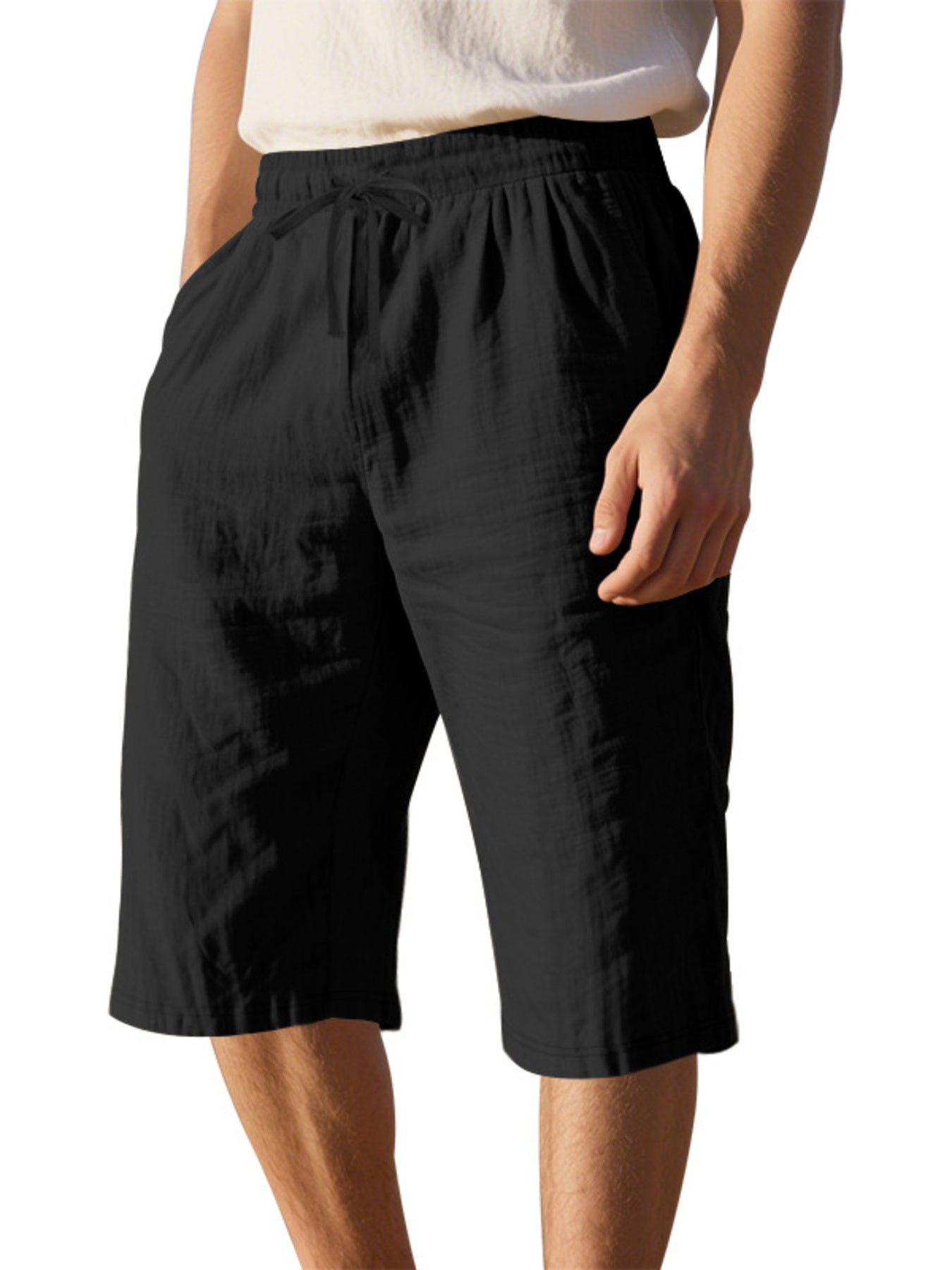 Men's casual shorts with a drawstring waist and pockets in the black color.