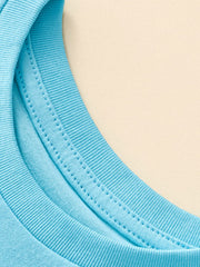 Close-up detail of the ribbed round neckline and stitching on pastel blue children's tee