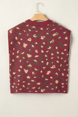 Hanging back view of a deep red leopard print cap sleeve knit top