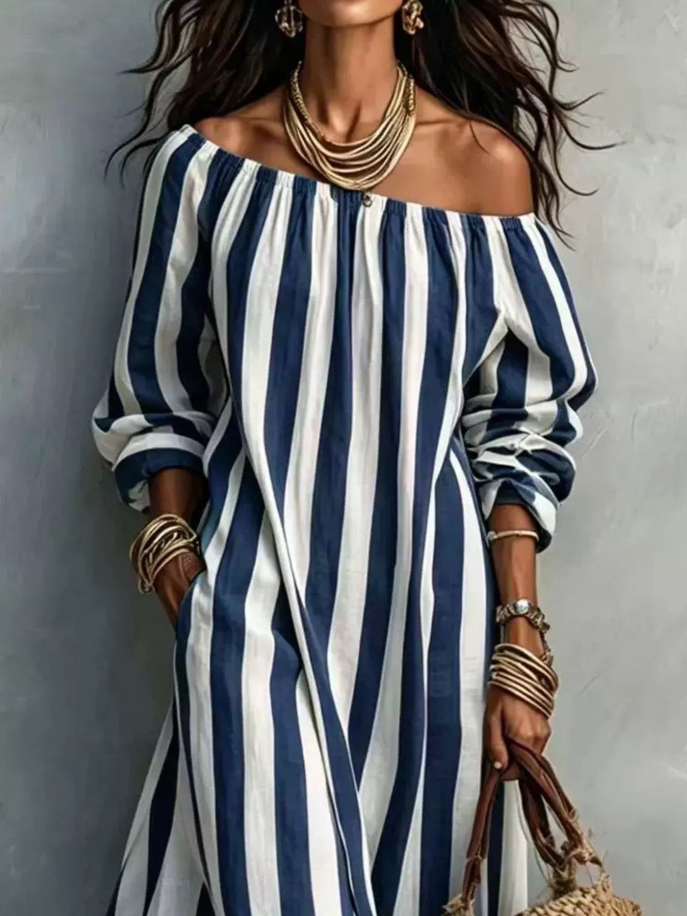 Close view of navy blue and white striped off shoulder dress bodice and sleeves