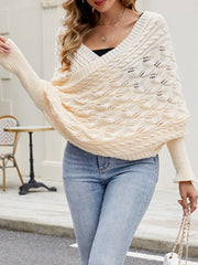 Front view of cream cable knit batwing sweater with V neckline and leaf pattern.