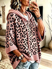 Pink leopard print oversized hooded knit sweater with black spots, front angle view