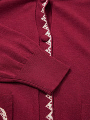 Close view of the burgundy cardigan button placket zigzag trim and cuff