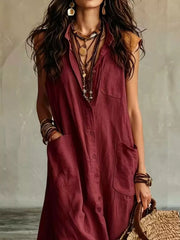 Close view of burgundy sleeveless button down linen maxi dress showing buttons and large pockets
