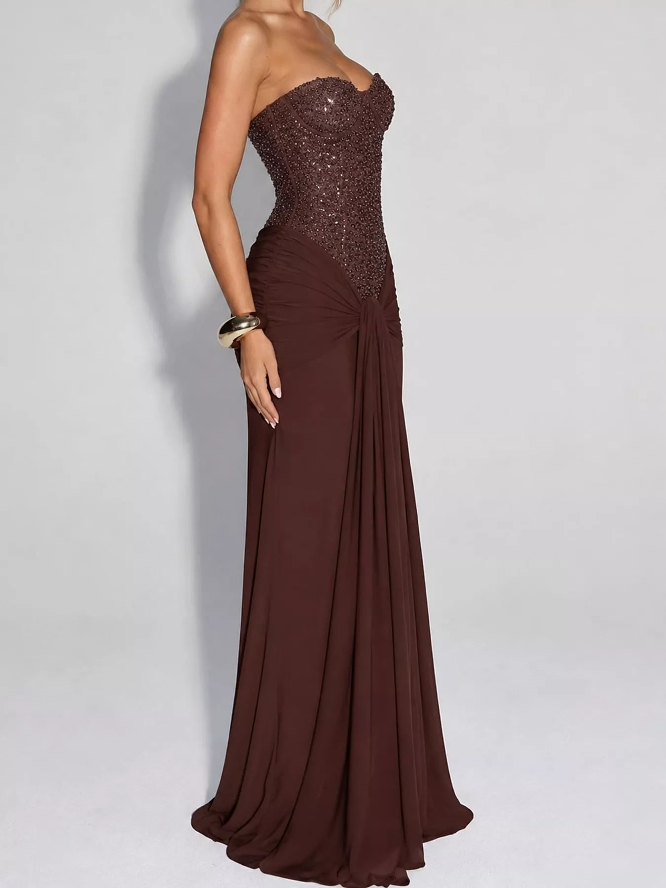 Dark Brown strapless sequin corset maxi dress on model, full length side profile in studio