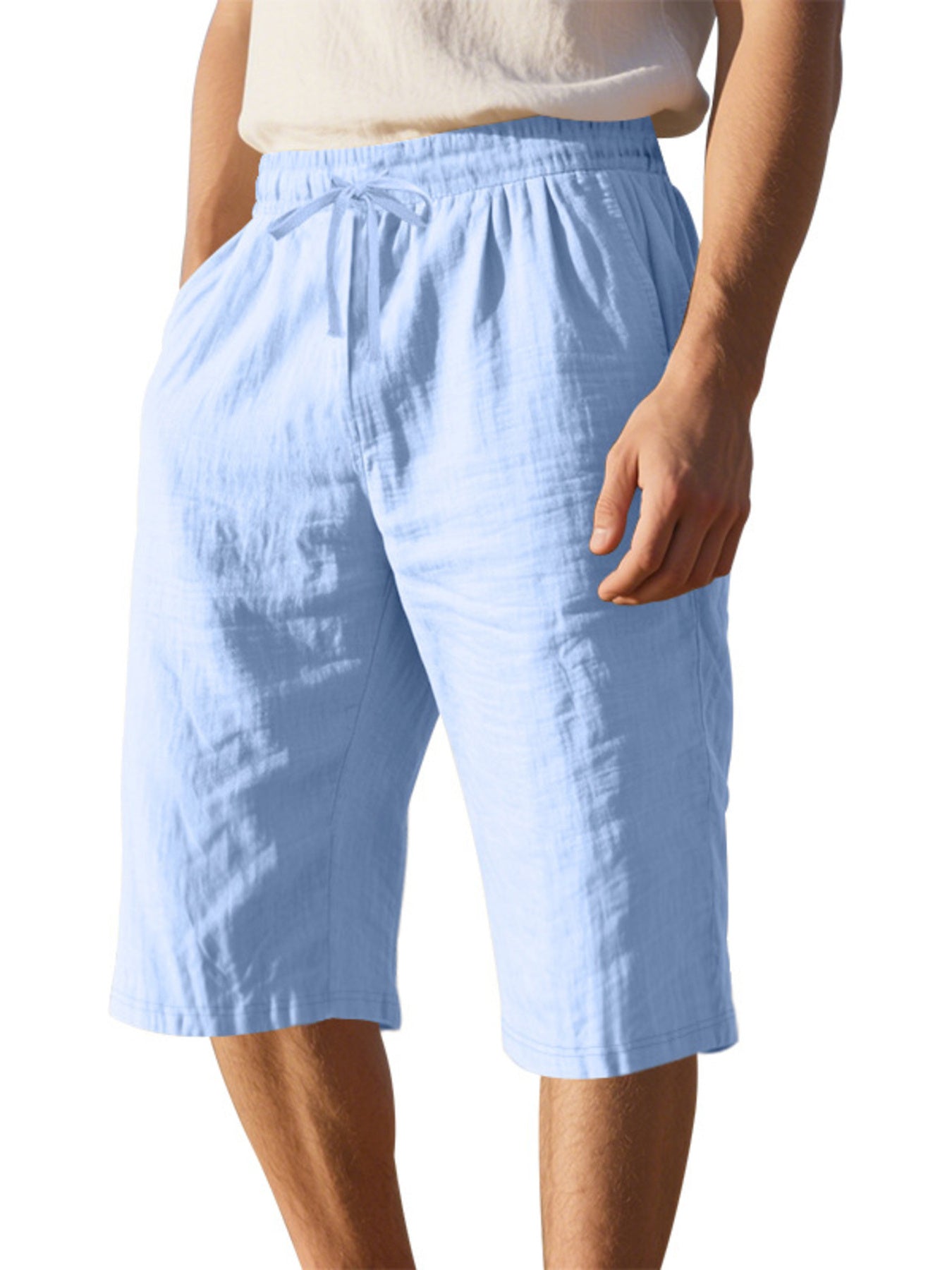 Men's casual shorts with a drawstring waist and pockets in the light blue color.