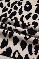 Close up detail of the folded leopard print knit fabric showing its soft texture.