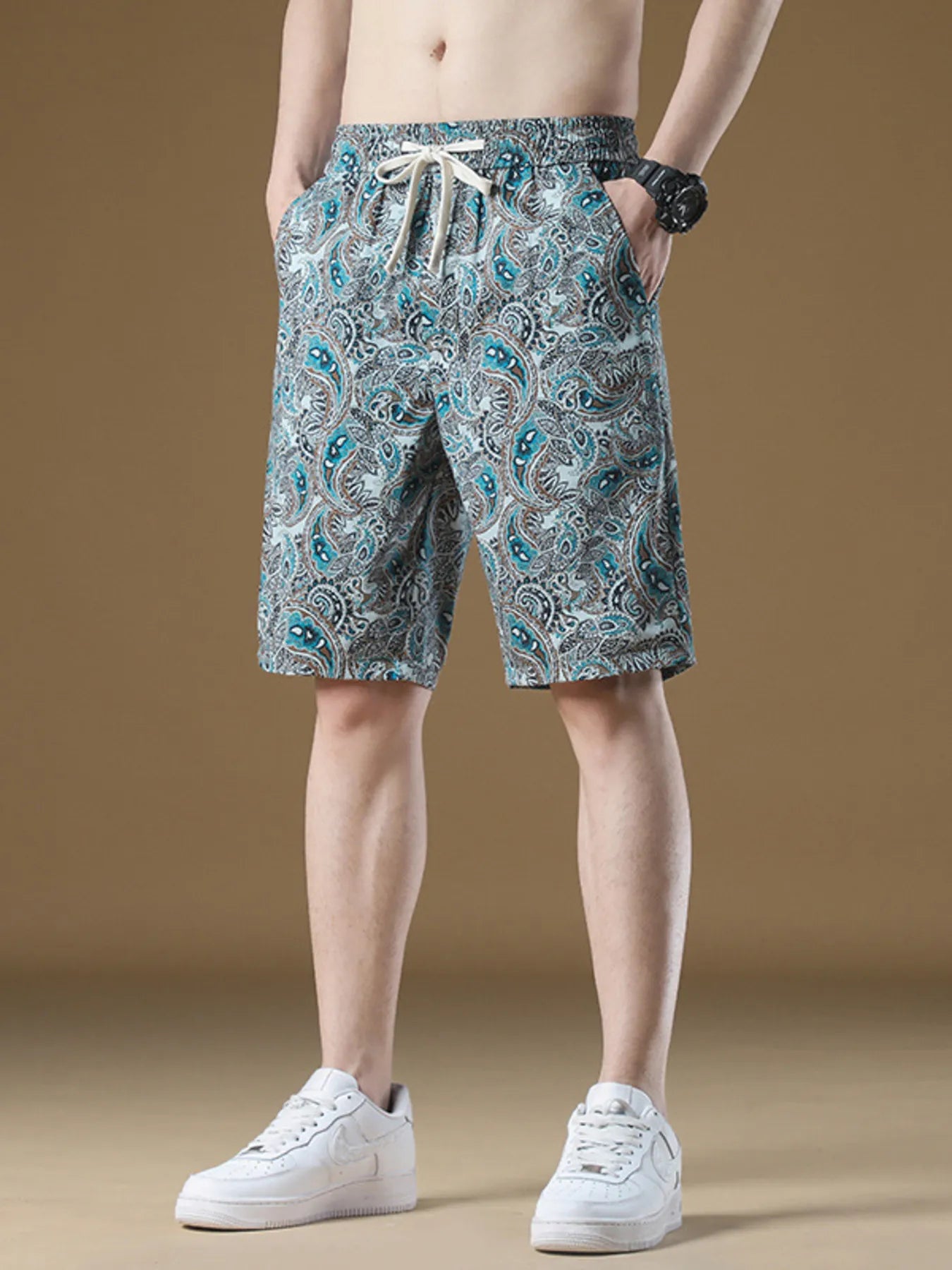 Men's French blue paisley-print shorts with a drawstring waist.