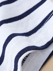 Close-up of the navy and white striped fabric and stitching detail on a children's T-shirt