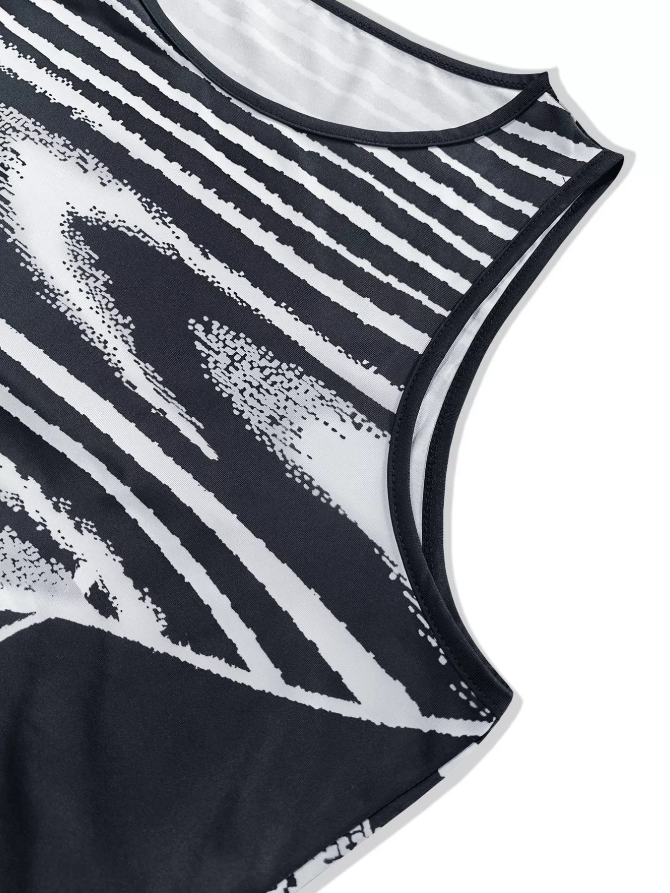 Close view of the neckline and armhole on a black and white sleeveless bodycon maxi dress