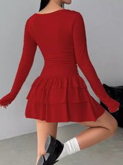 Red layered ruffle long sleeve mini dress worn from the back showing the ruched waist