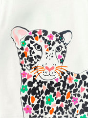 Close-up of the leopard face with black spots, pink hearts, and colorful flowers