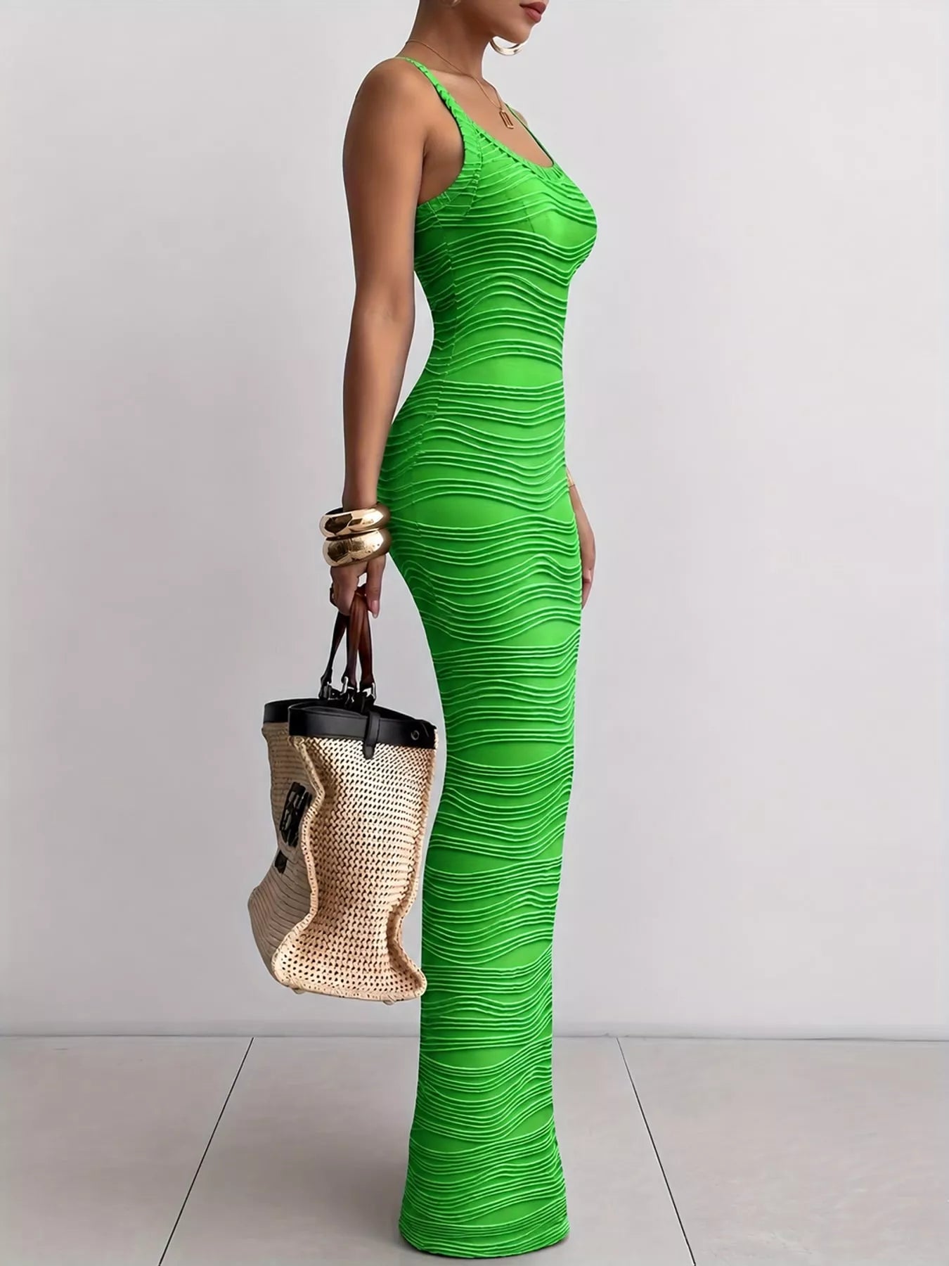 Bright green sleeveless bodycon maxi dress with wavy textured fabric in side profile