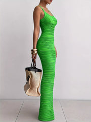 Bright green sleeveless bodycon maxi dress with wavy textured fabric in side profile