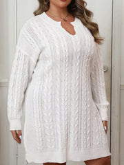 Side view of white cable knit sweater dress with long sleeves and side slit