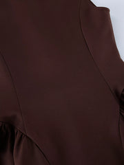 Brown button down mini dress detail showing bodice seams and gathered skirt sides