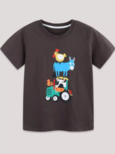 Chocolate children's short sleeve t-shirt laid flat with farm animals on a green tractor print