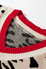 Close view of red and cream ribbed V neck trim on a leopard print sweater.
