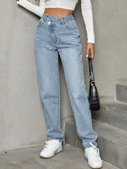 Women's straight-leg jeans with an asymmetrical waist, buttons, and pockets.
