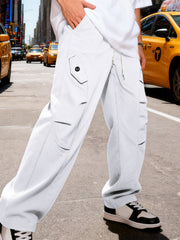 Men's white cargo pants with a drawstring waist and pockets.