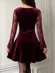 Back view of burgundy lace mini dress with velvet skirt and flared lace sleeves