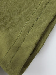 Close-up of olive children's t-shirt hem showing double stitching and smooth fabric