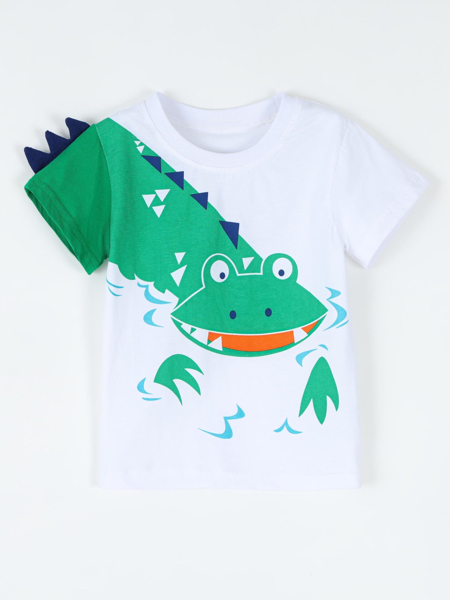 Flat front view of a white children's t shirt with a green crocodile graphic and spiked sleeve