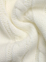 Extreme close up of white cable knit texture showing twisted cable pattern