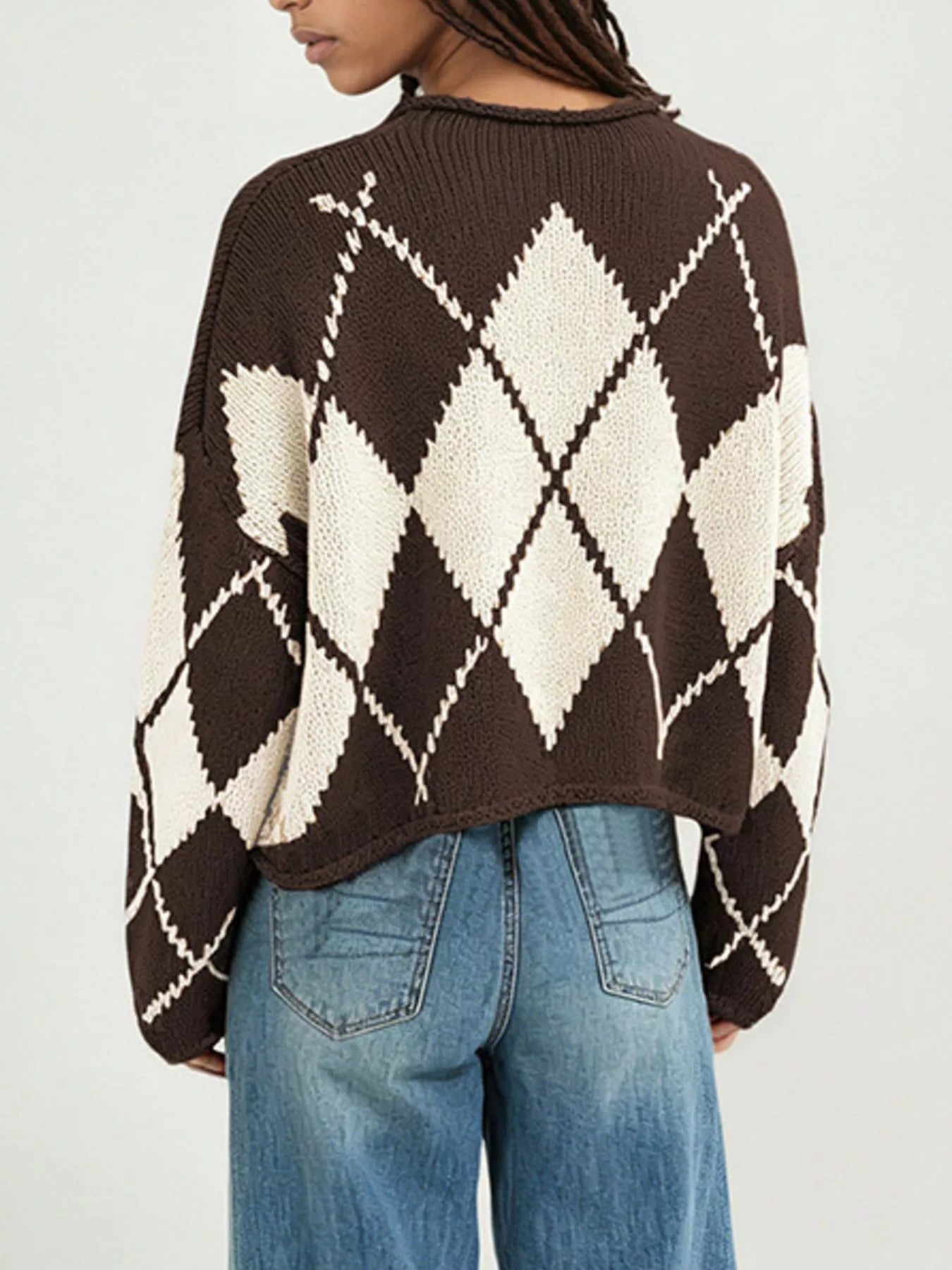 On-model back view of the brown and cream argyle knit sweater with dropped shoulders
