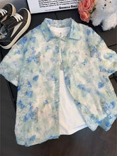 Men's textured floral-print shirt with button detailing and slight stretch.