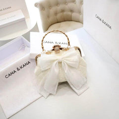 Large Bow Detailed Shimmery Top Handle Purse