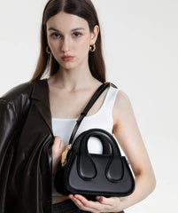 Small Black Top Handle Bag with Unique Gold Tone Hand Sculpture Black