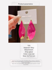 Stylish Gold Tone Abstract Leaf Drop Earrings with Vibrant Hot Pink Enamel Inlay