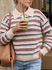 Front view of a cream striped polo sweater with pink, burgundy, and blue stripes