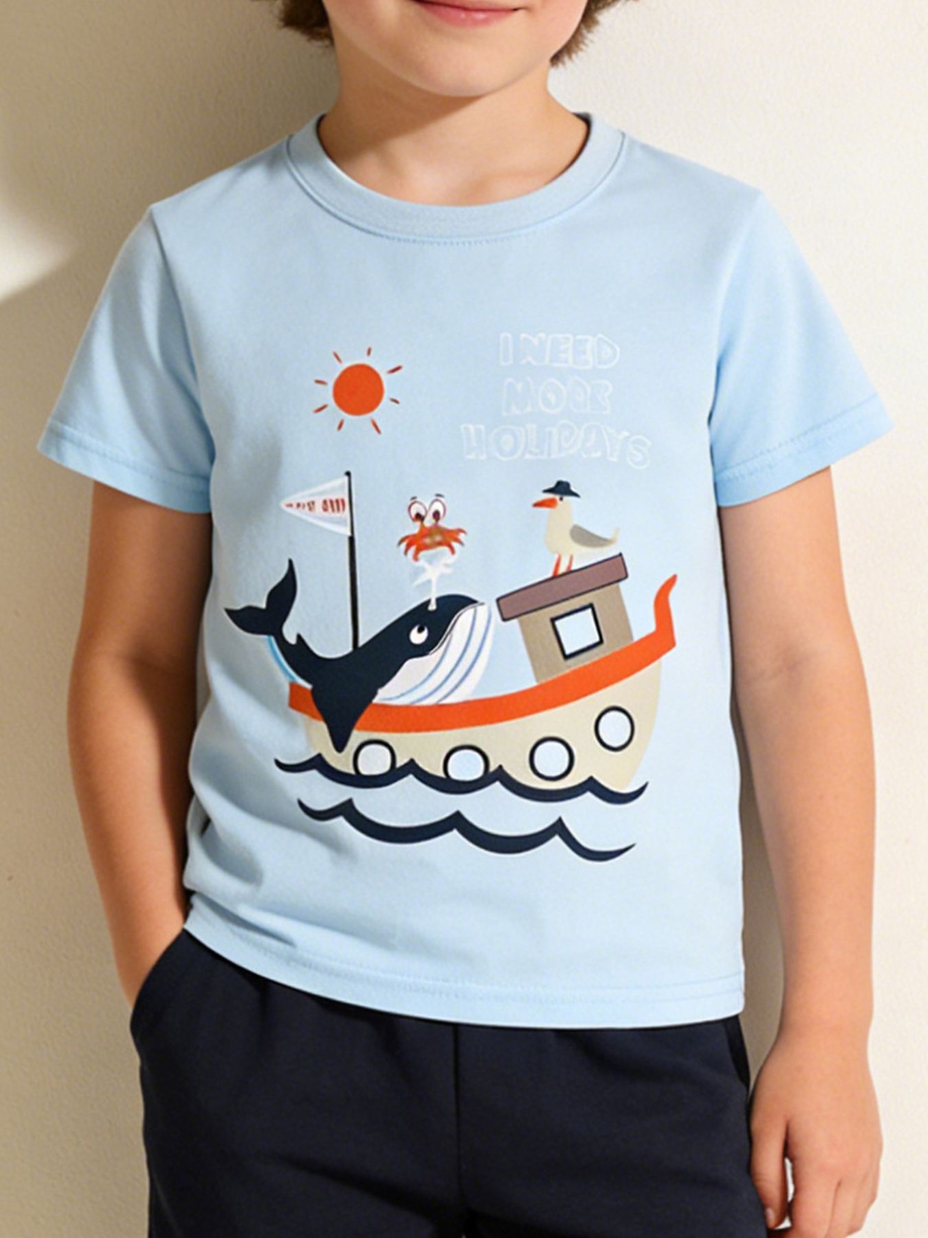 Front view of a light blue children's short sleeve tee with a whale boat graphic