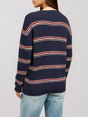 Back view of a dark blue striped ribbed knit top with long sleeves